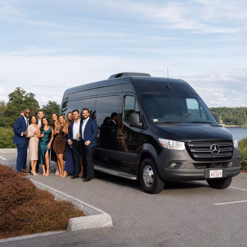 Group beside a Mercedes Sprinter limo from the Boston fleet