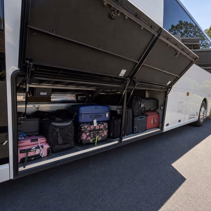 Party bus interior with wraparound leather seating and LED lighting in Boston