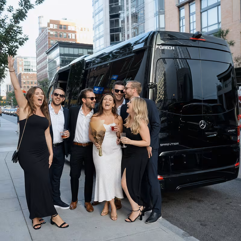 Group boarding a white charter bus for Bachelor & Bachelorette Transportation transportation in Boston