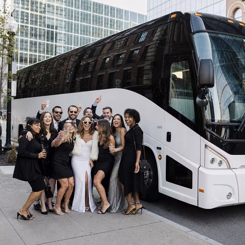 Passengers loading luggage while boarding an Boston group shuttle
