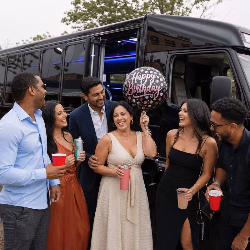 Party bus interior with wraparound leather seating and LED lighting in Boston
