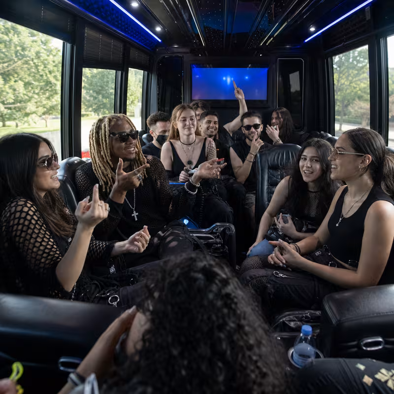 Passengers loading luggage while boarding an Boston group shuttle