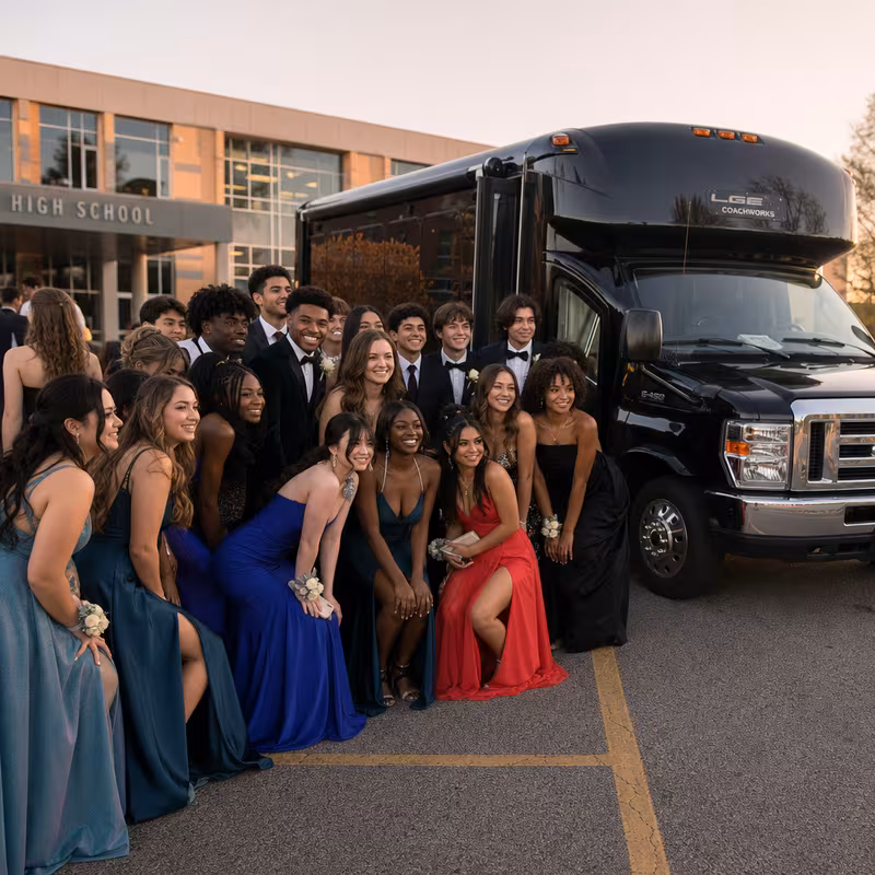 Group boarding a white charter bus for Prom & Homecoming Transportation transportation in Boston