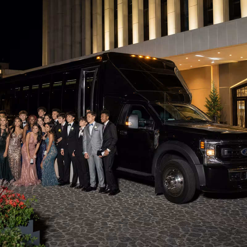 Party bus interior with wraparound leather seating and LED lighting in Boston