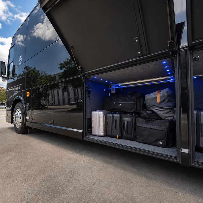 Party bus interior with wraparound leather seating and LED lighting in Boston