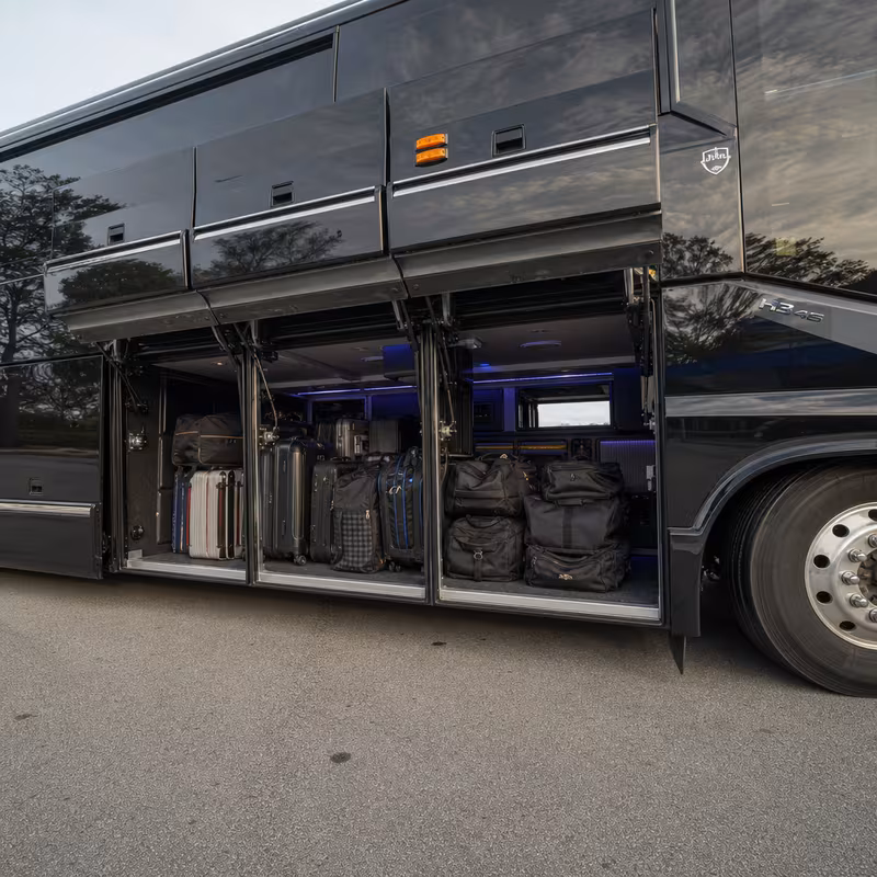 Party bus interior with wraparound leather seating and LED lighting in Boston
