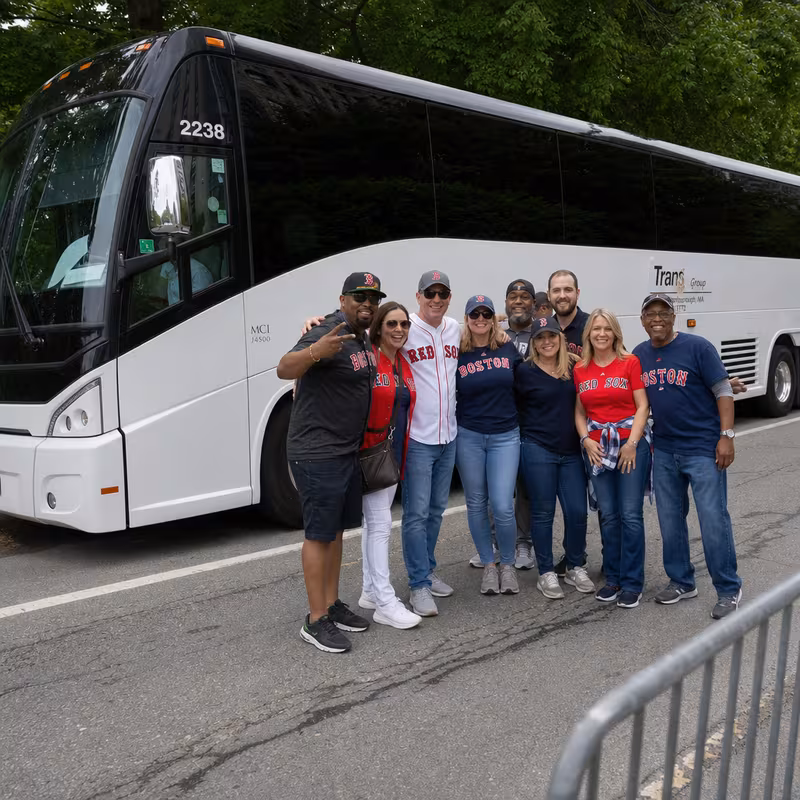 Passengers loading luggage while boarding an Boston group shuttle
