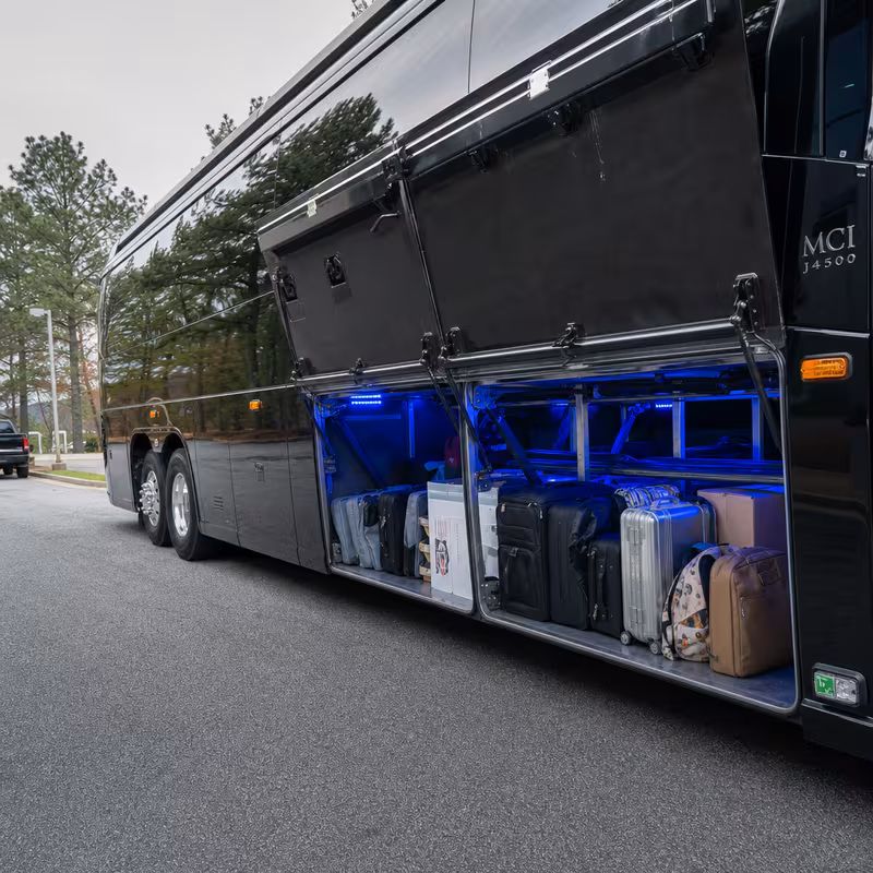 Party bus interior with wraparound leather seating and LED lighting in Boston