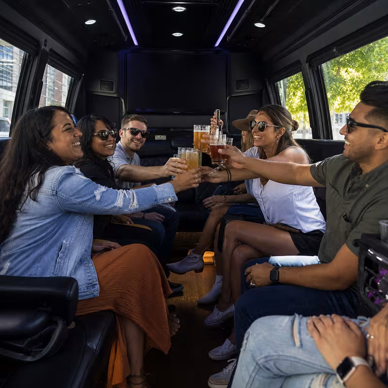 Group boarding a white charter bus for Winery & Brewery Tour Transportation transportation in Boston