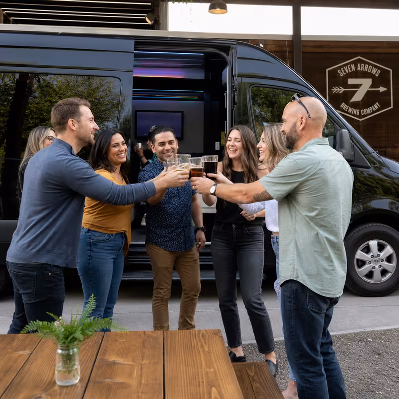 Passengers loading luggage while boarding an Boston group shuttle